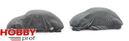Two VW Beetles under tarpaulin
